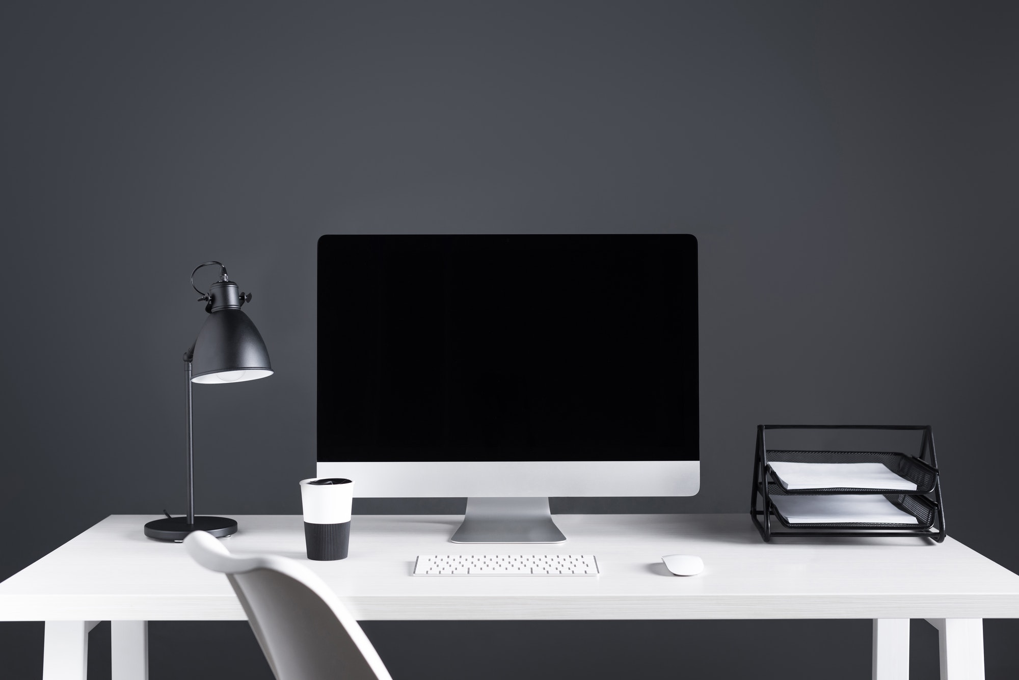 desktop computer with blank screen with keyboard and computer mouse at workplace