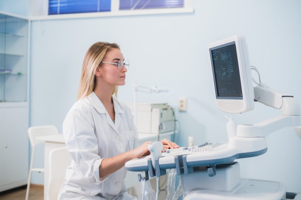 Smiling doctor, ultrasound. The doctor performed an ultrasound.