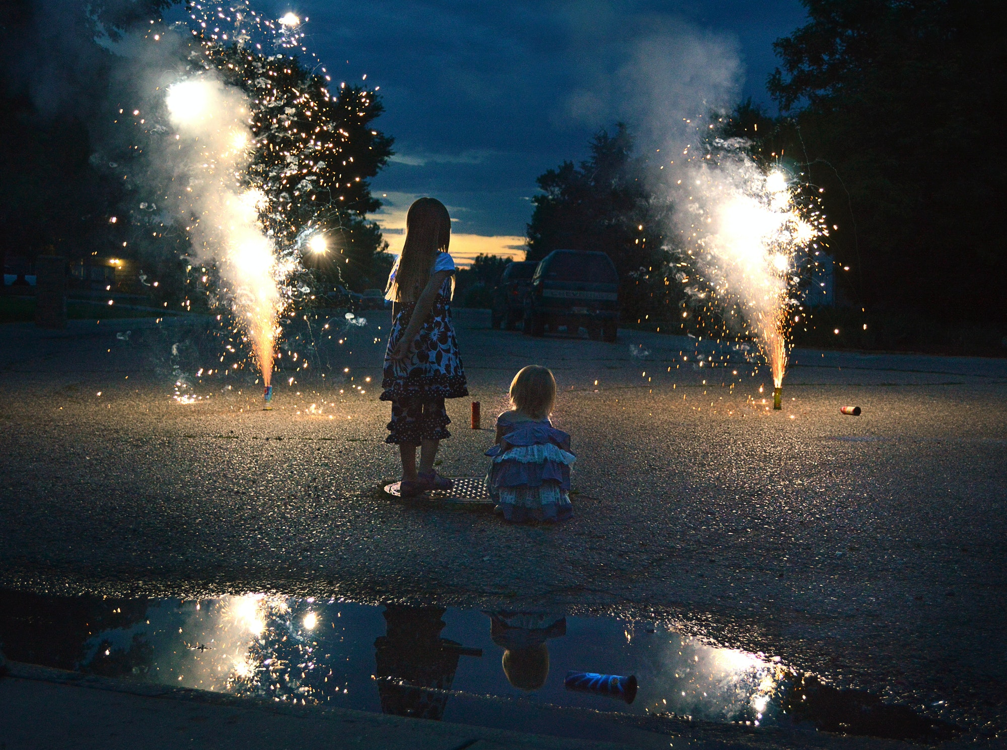 My daughter (right) and a neighbor girl watching street fireworks in Montana on July 4.